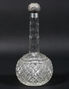 A silver topped cut-glass scent bottle, hallmarked Birmingham, 1898, makers marks for M. Bros.