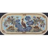 A Victorian beadwork and woolwork panel, woven with a bird amongst flowers and foliage, framed,