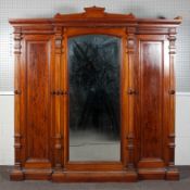 A large Victorian mahogany wardrobe-linen press, of architectural breakfront form,