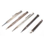 A collection of five silver propelling pens and pencils,