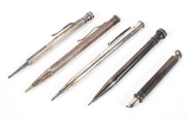 A collection of five silver propelling pens and pencils,