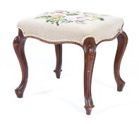 A Victorian needlework stool, of serpentine form,