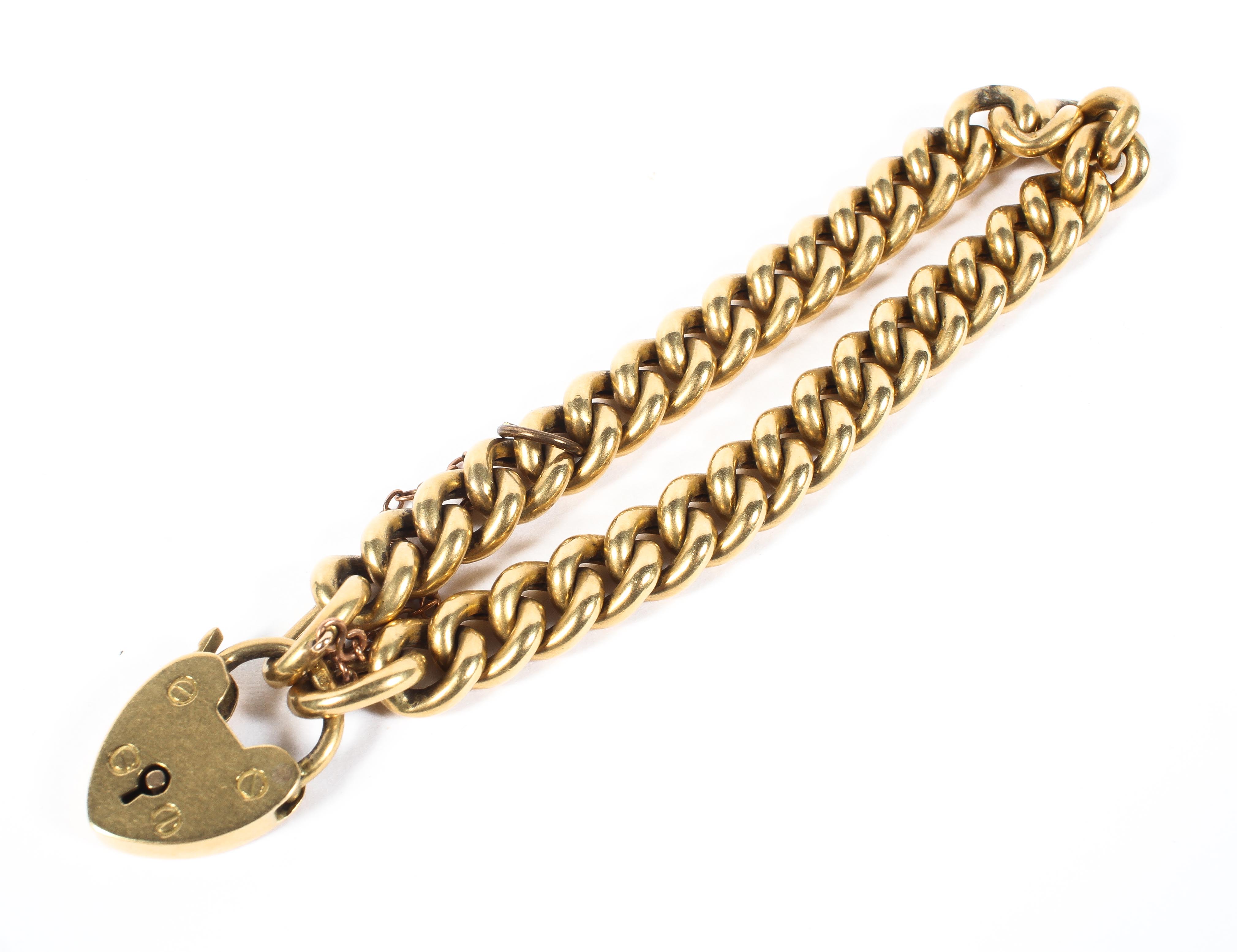 An 18ct gold curb link bracelet with heart locket, the locket hallmarked Sheffield 1930, 19.