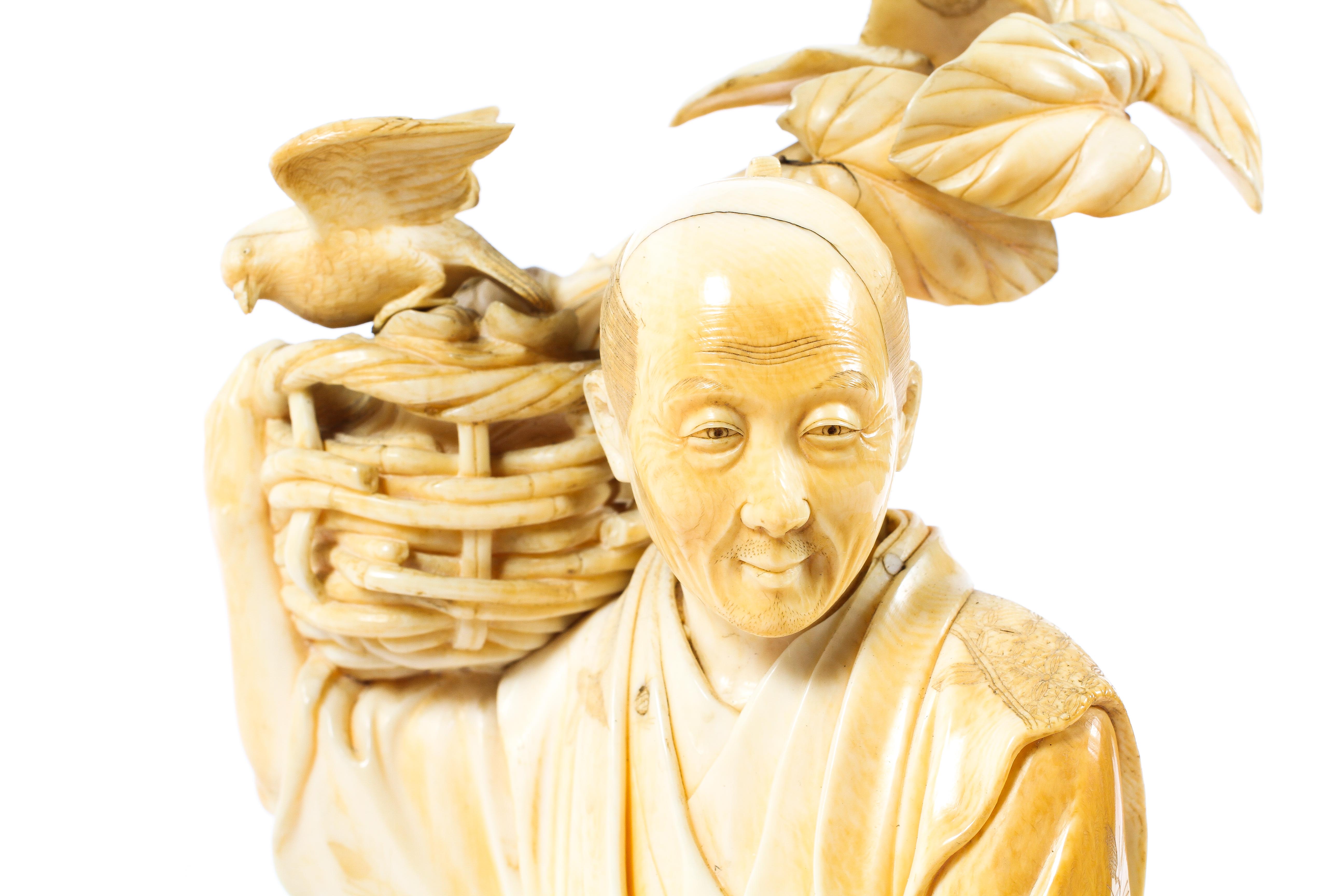 A Japanese ivory okimono, Meiji period, of a man holding a basket of vegetables - Image 3 of 4