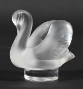 A small Lalique model of a frosted glass swan, on circular base etched 'Lalique/France',