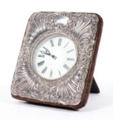 A silver mounted quartz clock, cast with rocailles and cartouches, hallmarked London, 1991,