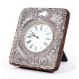 A silver mounted quartz clock, cast with rocailles and cartouches, hallmarked London, 1991,