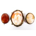 Two cameos: one late 19th century carved cameo, a smaller example, together with an agate brooch