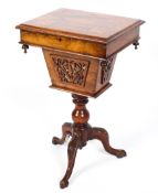 A 19th century inlaid sewing table on carved tripod base,