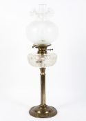 A 20th century brass table lamp, the column support on a circular base,