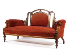 A Victorian walnut framed upholstered sofa,