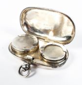 A sterling silver sovereign and half sovereign case. by Henry Williamson, Birmingham 1910. 29g.