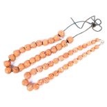 Two strands of Oriental carved pink coral beads