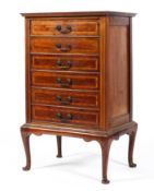 An Edwardian Henry Stone & Co. mahogany music cabinet