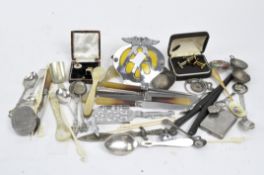 A box of mixed collectables, including an AA badge, cufflinks, a pair of glove stretchers,