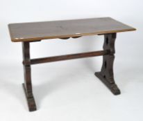 A 20th century mahogany refectory table, the pierced columns adjoined by a stretcher,
