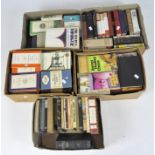 A large collection of assorted vintage and modern books, primarily novels,