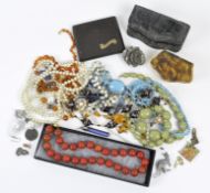 A selection of assorted costume jewellery, including necklaces, bakelite cigarette case,