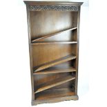 A stained oak contemporary bookcase, the large structure featuring adjustable shelves,