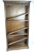 A stained oak contemporary bookcase, the large structure featuring adjustable shelves,