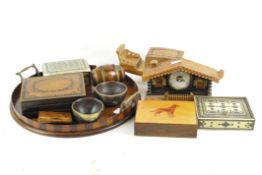 A collection of 20th century treen, to include inlaid boxes, a circular tray with twin handles,