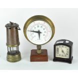 An antique coal miners lamp together with a Smiths mantle clock and a brass cased pressure gauge