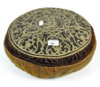An Islamic cushion, of circular shape with embroidered decoration of a velvet ground,
