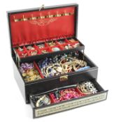 A large tiered jewellery box containing a selection of vintage costume jewellery,