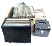 A collection of 7" LP's and records, containing a variety of pop and country music,