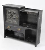 A wooden ebonised table top unit, with various shelves,