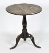 An early 20th century round oak side table on a turned support and tripod foot, height 64cm,