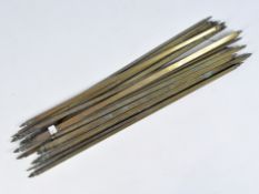 A quantity of early 20th century brass stair rods, the majority with the same finial design,