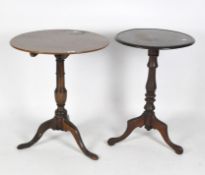Two mahogany circular occasional tables, with turned columns and raised on tripod supports,