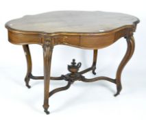 A reproduction wooden table, of curved form with a single drawer to either side,
