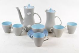 A pale grey and blue Poole part coffee set and four further pale blue Poole saucers