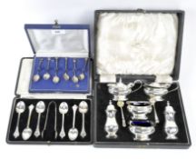A six piece silver set of teaspoons together with matching sugar tongs,