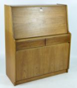 A mid-20th century teak retro style bureau, with a fall front above two drawers and a cupboard,