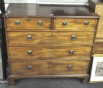 A Victorian mahogany chest of drawers, featuring two short drawers above three long ones,