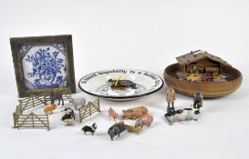A selection of collectables, including an enamel bowl, lead farm animals, Delft tile, and more