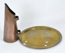 A large 19th century tapering conical copper coal scuttle and an engraved brass charger,
