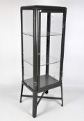 A glazed metal lockable display cabinet with two adjustable glass shelves,