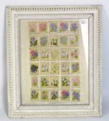 A framed set of embroidered silk card panels, all decorated with flowers, 49cm x 39cm,