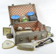 A case of assorted collectables, including a Rabone folding measure, Europa travel clock, and more