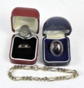 A selection of costume jewellery, including a silver ring and two others, brooches, a bracelet,