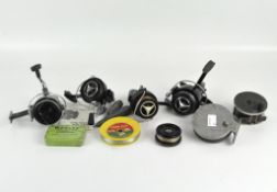 A collection of fishing reels and weights,