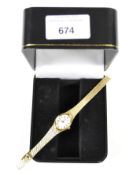 A ladies yellow metal Pulsar cocktail watch, gilt dial with Roman numerals, on a bracelet strap,