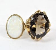 Two ladies 9ct gold dress rings, one set with a cabachon opal, the other a large claw set stone,