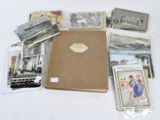 An early stamp album containing various GB world stamps, and a selection of postcards