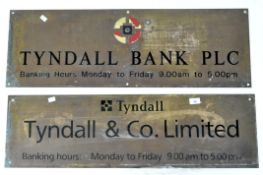 Two metal and enamel Tyndall signs reading 'Tyndall & Co. Limited' and 'Tyndall Bank Plc'