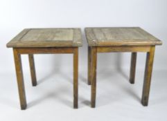 A pair of wooden tables, of square form with rectangular legs,